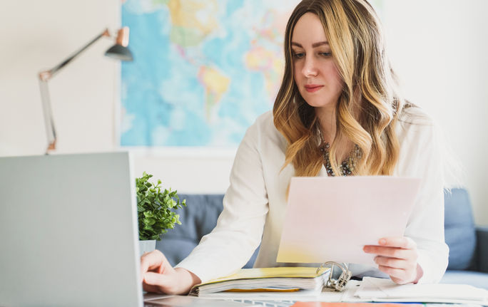 A travel advisor working on her computer.