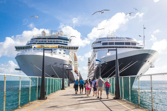 Two cruise ships on either side of dock, cruise ships, stock image of cruise ships