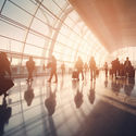 Crowd of travelers inside an airport terminal