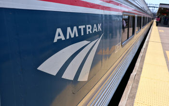 Amtrak logo on the side of a train.