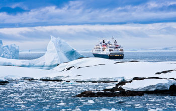 Big cruise ship in the Antarctic waters (Photo via goinyk / iStock / Getty Images Plus)