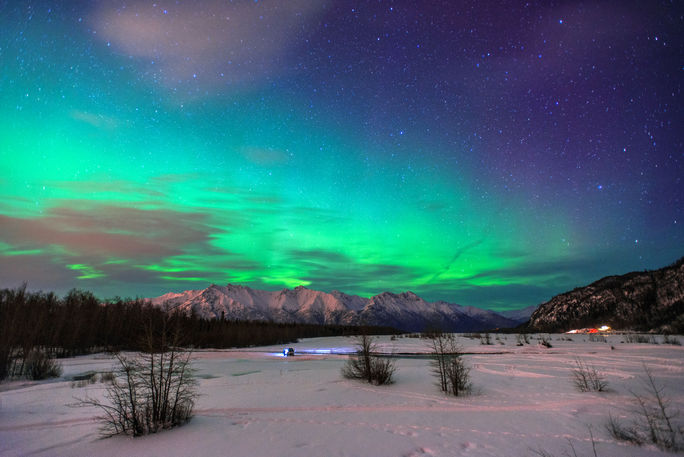 Beautiful green Northern light (Aurora Borealis) at Knik River in Alaska. (Photo via CNaene / iStock / Getty Images Plus)