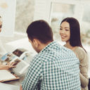 Young couple speaking to a travel advisor