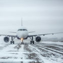 Airliner on runway in blizzard, snow, ice, plane,