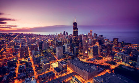 Chicago skyline aerial view at dusk, United States (Photo via  marchello74 / iStock / Getty Images Plus)