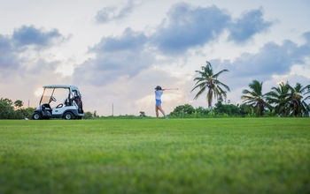 A woman playing golf