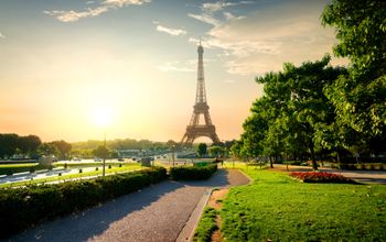 Eiffel tower near green park in Paris, France