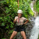 G Adventures guest zip-lining during the Solo-ish Costa Rica tour.