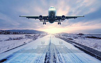 Plane takes off in the snow.