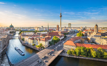 Aerial view of Berlin skyline with famous TV tower and Spree river in beautiful evening light at sunset, Germany. (photo via bluejayphoto/iStock/Getty Images Plus)