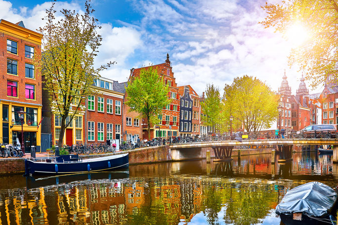 Historic buildings and canal in Amsterdam's historic center.