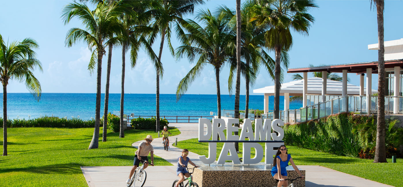 Image: A family biking at Dreams Jade Resort & Spa. (photo via Dreams Resorts & Spas)