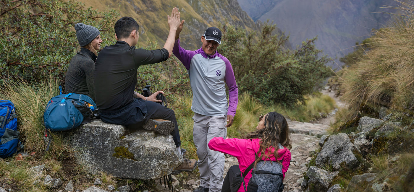 Image: A G Adventures group takes a break while hiking the Inca Trail in Peru. (Photo Credit: G Adventures)