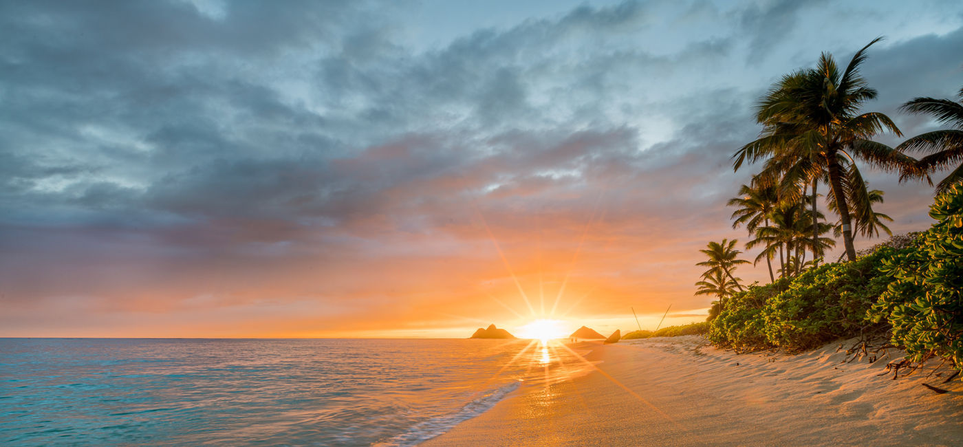 Image: A sunrise on Lanikai Beach, Oahu, Hawai'i. (Photo Credit: Adobe Stock / RonPaulk Photography)