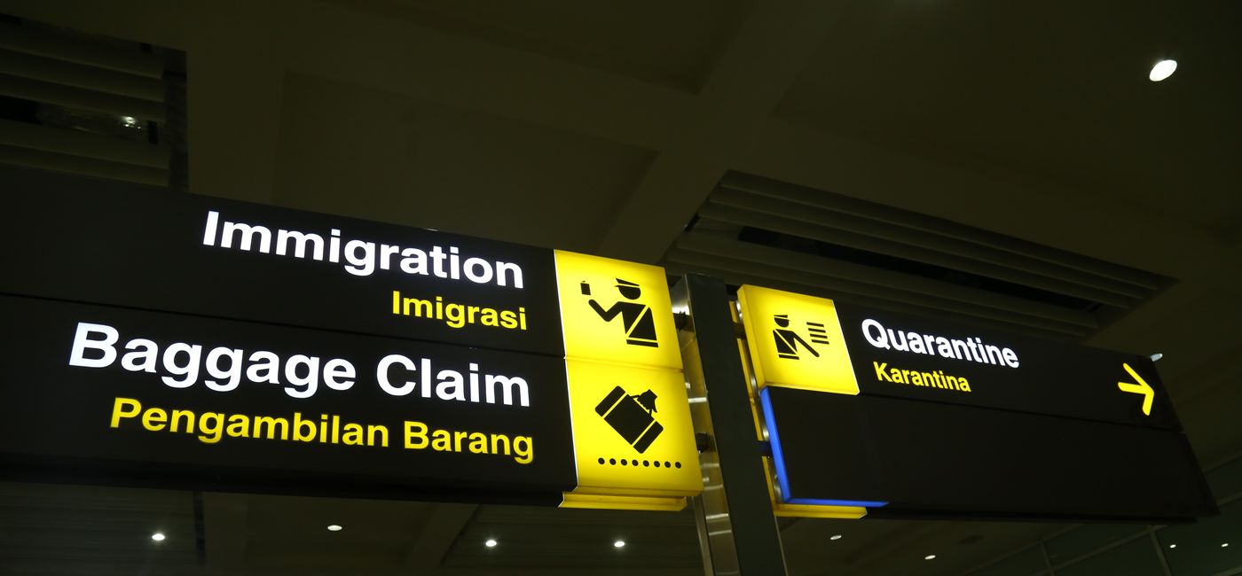 Image: Airport signage at the I Gusti Ngurah Rai Airport in Bali, Indonesia. (Photo Credit: ejajuga / AdobeStock)