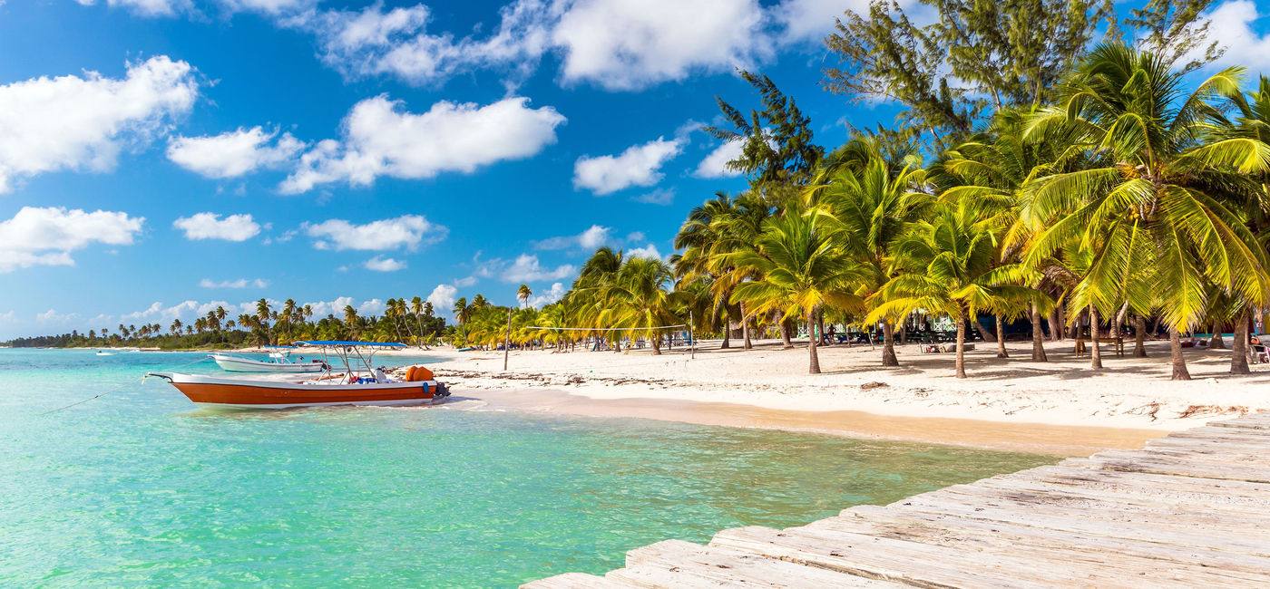 Image: Beautiful Caribbean beach on Saona Island, Dominican Republic. (photo via czekma13 / iStock / Getty Images Plus)