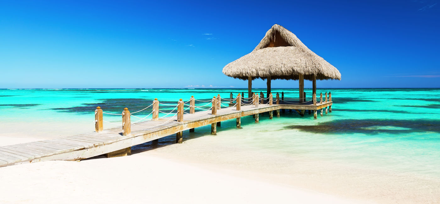 Image: Beautiful gazebo on the tropical white sandy beach in Punta Cana, Dominican Republic (Photo via  Preto_perola / iStock / Getty Images Plus)