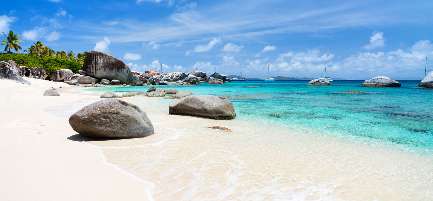 Image: Beautiful tropical beach with white sand, turquoise ocean water and blue sky at Virgin Gorda, British Virgin Islands in Caribbean (Photo via shalamov / iStock / Getty Images Plus)