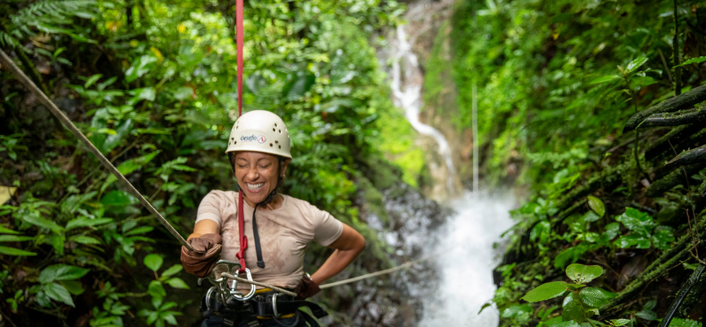 Image: G Adventures guest zip-lining during the Solo-ish Costa Rica tour. (Photo Credit: G Adventures)