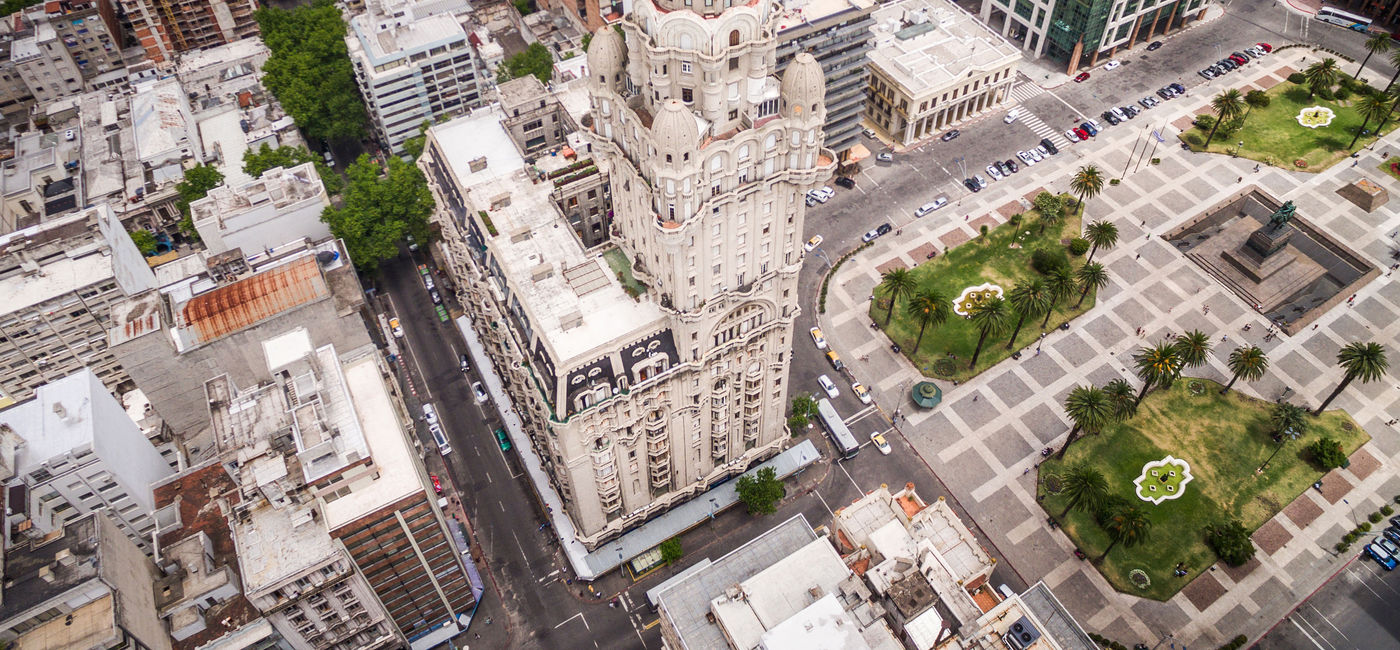 Image: Montevideo, Uruguay, aerial view of downtown buildings and Plaza Independencia square. (photo via rmnunes / iStock / Getty Images Plus)