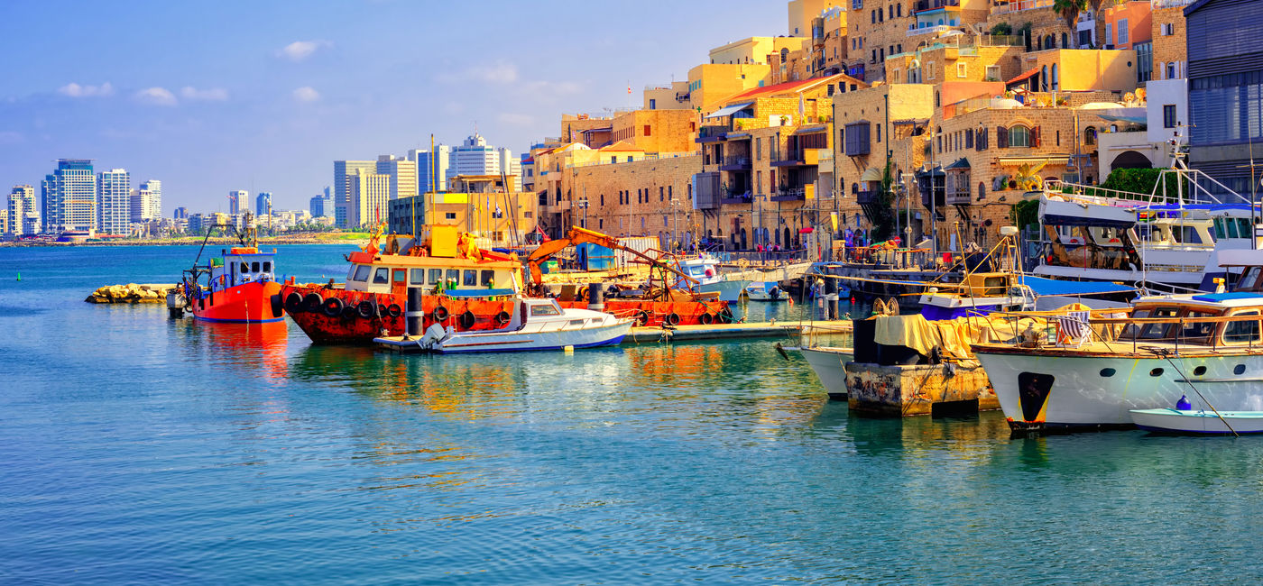 Image: Old town and port of Jaffa and modern skyline of Tel Aviv, Israel. (photo via Xantana / iStock / Getty Images Plus)