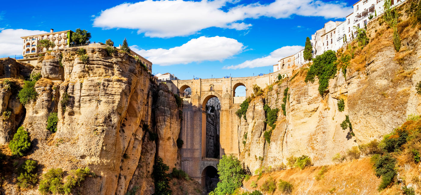 Image: Panoramic view of the old city of Ronda, one of the famous white villages in the province of Malaga, Andalusia, Spain (photo via MarquesPhotography / iStock / Getty Images Plus)