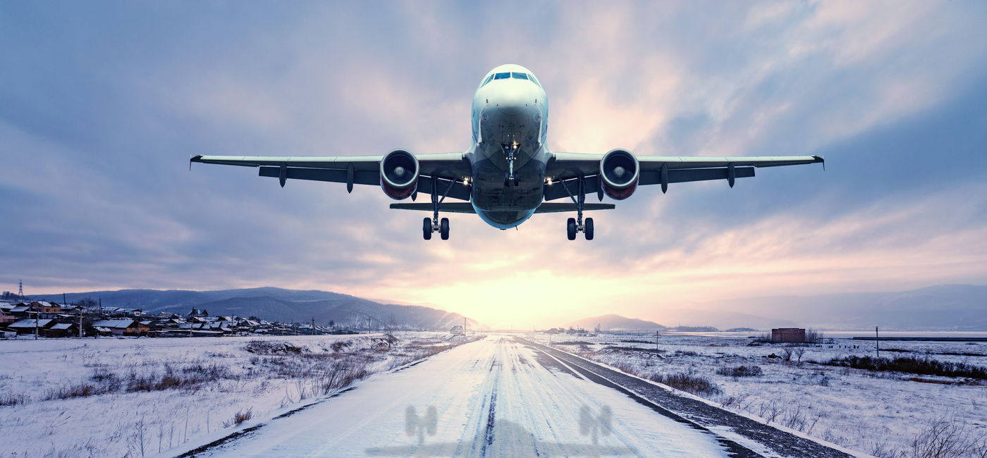 Image: Plane takes off in the snow. (Photo Credit: erjiob74/Adobe Stock)