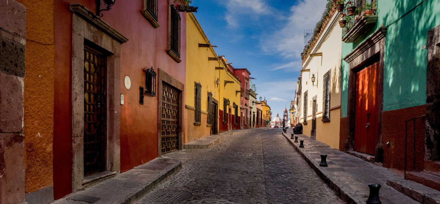 Image: The many backstreets of San Miguel de Allende in Mexico can be quiet, colorful and beautifully preserved. A wonderful serene place for a morning or evening walk. (photo via thupton / iStock / Getty Images Plus)