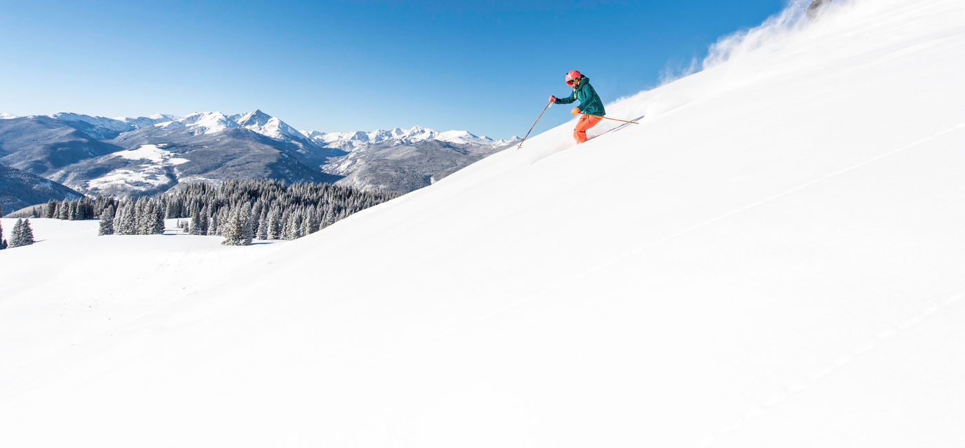 Image: Two skiers ski down a snowy hill at a Vail Resorts resort. (photo via Vail Resorts) (Photo Credit: (photo via Vail Resorts))