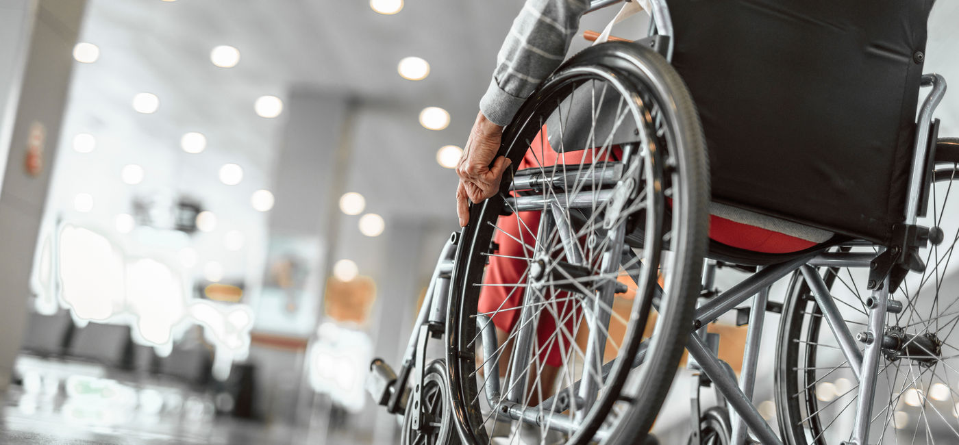 Image: Wheelchair user at the airport. (Photo Credit: Adobe Stock/Yakobchuk Olena)