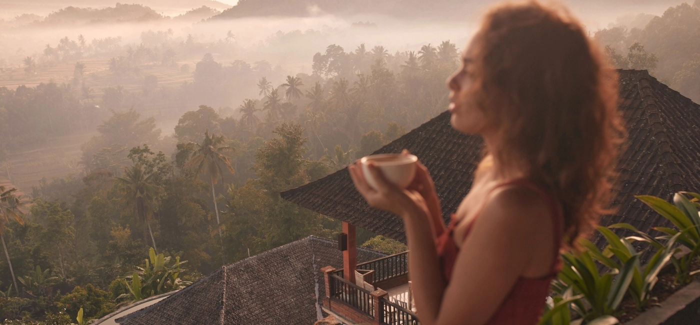 Image: Woman at a wellness retreat in Bali, Indonesia. (Photo Credit: Adobe Stock/puhhha)