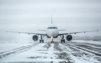 Airliner on runway in blizzard, snow, ice, plane,