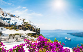 Santorini island, Greece. Beautiful view on the sea (photo via Olga_Gavrilova / iStock / Getty Images Plus)