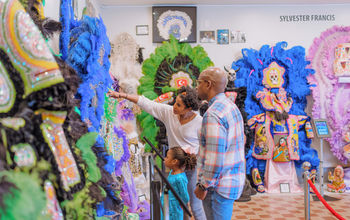 Family Visiting Backstreet Cultural Museum by Justen Williams