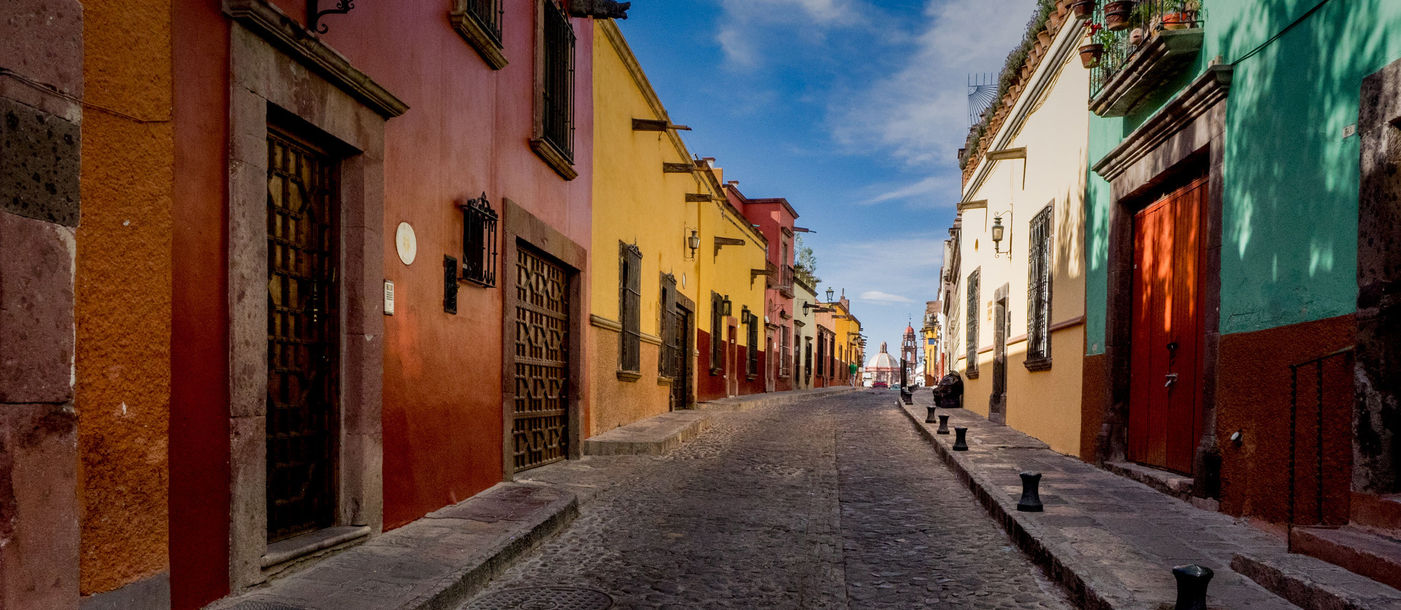 The many backstreets of San Miguel de Allende in Mexico can be quiet, colorful and beautifully preserved. A wonderful serene place for a morning or evening walk. (photo via thupton / iStock / Getty Images Plus)