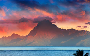 View on mountain Orohena at sunset. Polynesia. Tahiti. (photo via Konstik / iStock / Getty Images Plus)