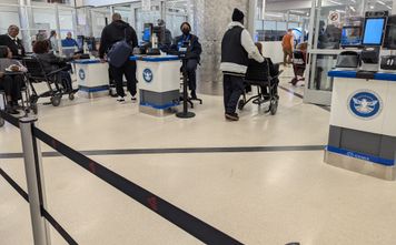 TSA security line, travel, travelers, crowd, wheelchair,