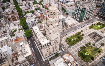 Montevideo, Uruguay, aerial view of downtown buildings and Plaza Independencia square. (photo via rmnunes / iStock / Getty Images Plus)