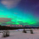 Beautiful green Northern light (Aurora Borealis) at Knik River in Alaska. (Photo via CNaene / iStock / Getty Images Plus)