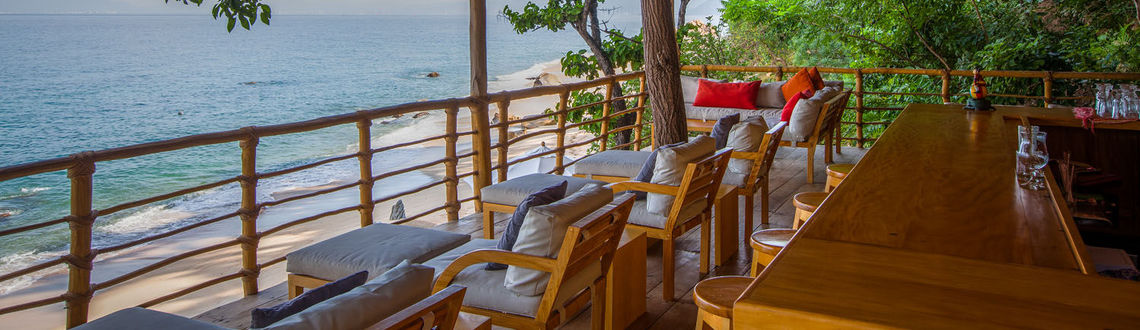 Thatched roof bar above beach